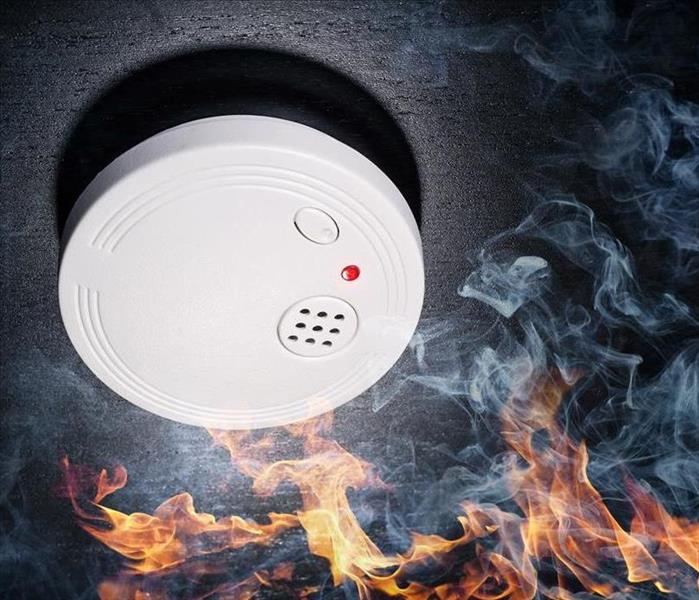 Smoke Alarm Surrounded by flames and smoke